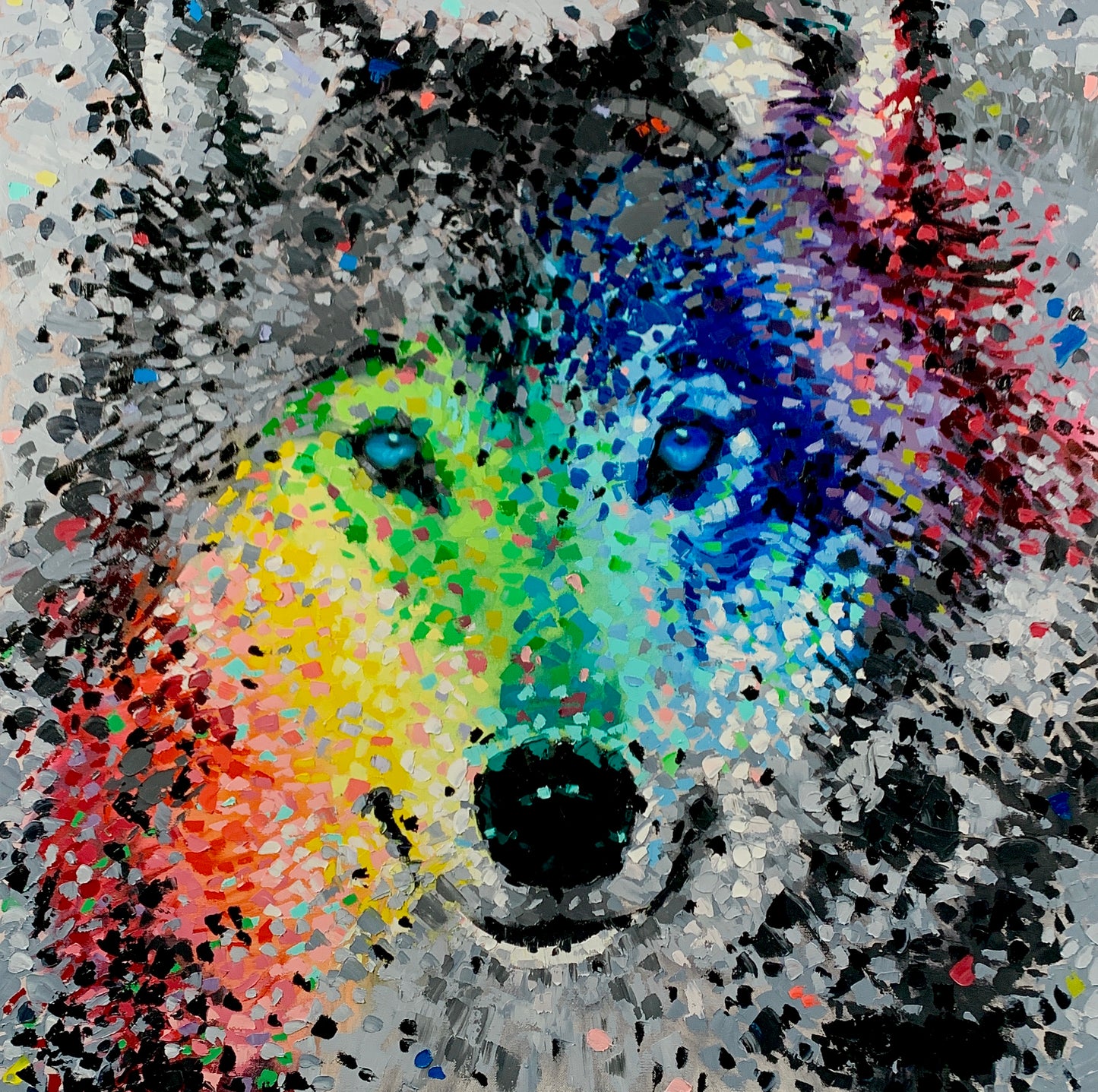 colorful abstract painting of a wolf’s face with blue eyes and a black nose.