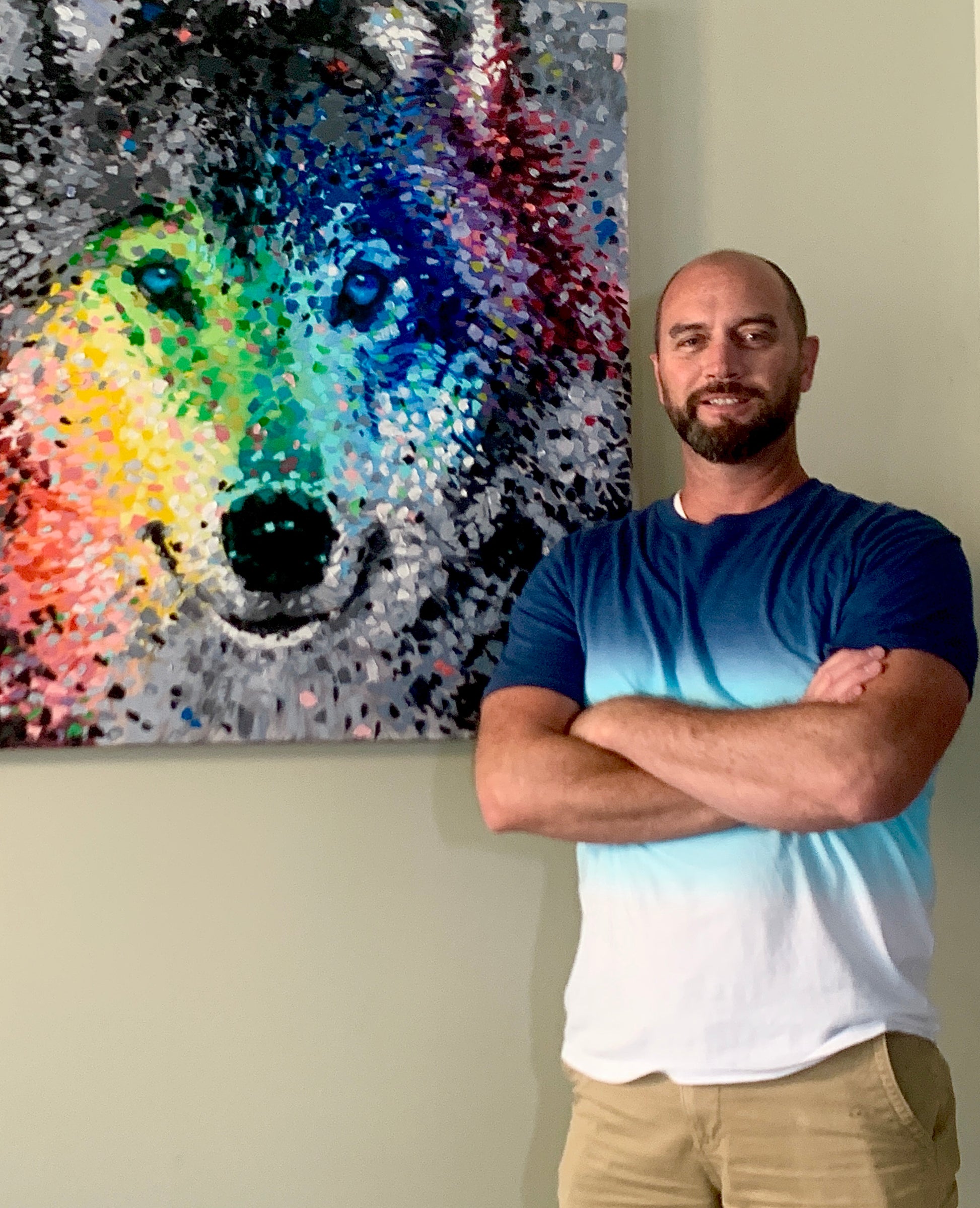 Brandon Bouck artist with the wolf painting